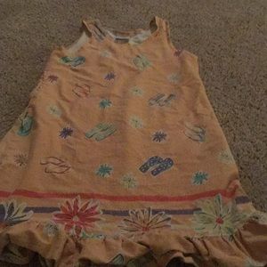 A dress that is orange.